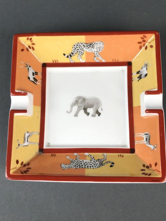 Hermes Porcelain Animal Motif Ashtray: Hermes Porcelain Animal Motif Ashtray 1 1/2"h x 6 1/4" square. Condition, some wear to paint , remnants of old paper on bottom