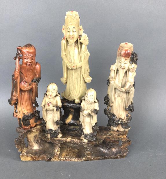 Chinese Soapstone Carving of Immortals on Base.: Chinese Soapstone Carving of Immortals on Base. 10 1/2"h x 8 1/2"w x 2"d. Condition, some scratches, scuffs, and minor chips.Some wooden pegs are broken.
