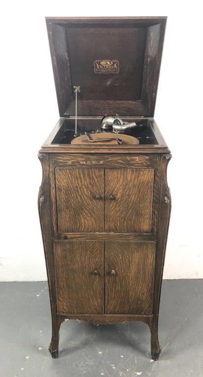 Victrola in Oak Cabinet: Victrola in Oak Cabinet. 44"h x 21 1/2"w x 23"d. Condition, some scratches and scuffs, untested