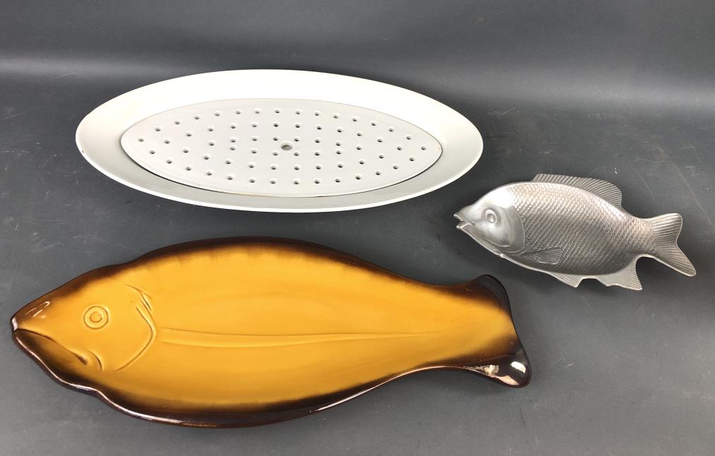 Group of Fish Platters: Group of Fish Platters. One with drainer made by Arabia, Finland Largest is 24" x 9 1/2". Condition, needs cleaning, some scratches and scuffs drainer platter has some chips and some stains, other lar