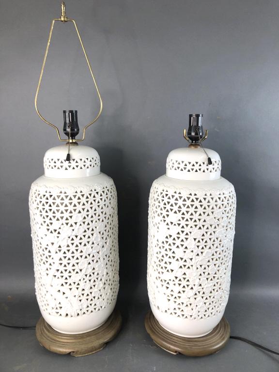 Pair of Reticulated White Porcelain Lamps: Pair of Reticulated White Porcelain Lamps . 23"h to top of light socket.. Condition, untested, 2 different fixtures on top, needs cleaning, scratches and scuffs to base