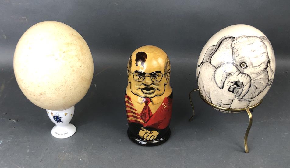 2 Ostrich Eggs: 2 Ostrich Eggs. Together with nesting dolls of Russian past presidents, Nesting dolls are 7"h. Condition, egg needs cleaning