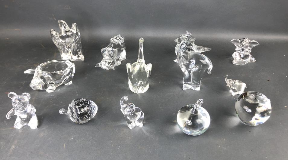 Group of Crystal Animal and Fruit: Group of Crystal Animal and Fruit. Including a Tiffany Apple, Daum Teddy Bear, Villeroy and Boch Elephant, Baccarat Bull, etc. Tallest is 7"h. Approx. 13 pieces.Condition, chip to horn of Baccarat Bul