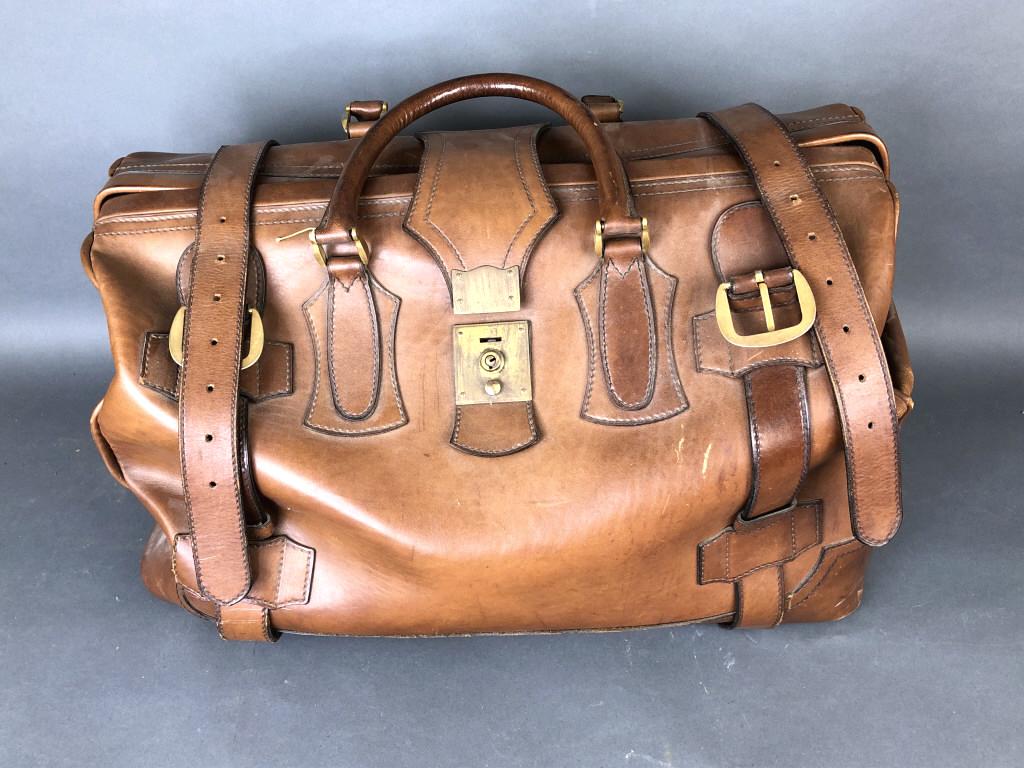 Leather Travel Bag.: Made in Italy for Britches. 14 1/2"h x 23 1/2"w x 16"w. Condition, some wear, scratches and scuffs