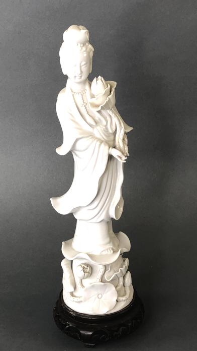 Kuan Yin Guanyin Blanc De Chine Porcelain Figure: Kuan Yin Guanyin Blanc De Chine Porcelain Figure. On stand. Overall height on stand is 11 1/4" Condition - scratches and scuffs to wood base