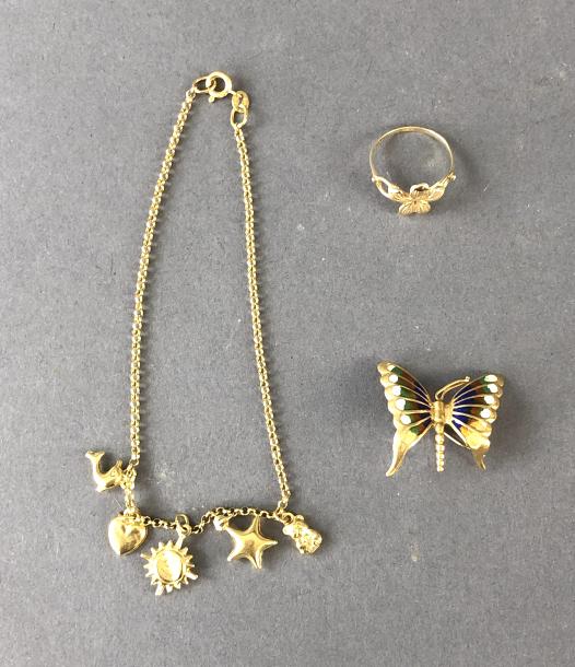 18K Gold and Enamel Butterfly: 18K Gold and Enamel Butterfly . Together with 14 k gold charm bracelet and ring. Total approx 8 DWT all in. Condition - bent wing and clasp on butterfly