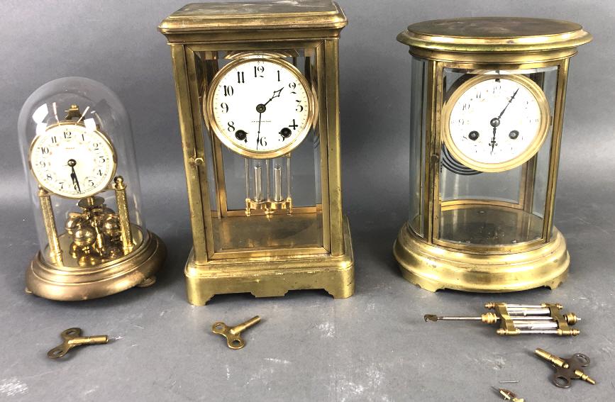 Group of 3 Brass Clocks.: Manufactured by Tiffany & CO., Seth Thomas & Heco. Seth Thomas is 11"h x 7"w x 5"d. Condition, untested, wear to brass, Tiffany clock in need of restoration and comes with a bag of small parts