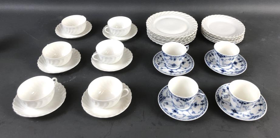 4 Royal Copenhagen Cups and Saucers: 4 Royal Copenhagen Cups and Saucers. Together with Nymphenburg cups, saucers and plates. Copenhagen saucers are 5 1/4" diam. The largest white porcelain plates are 7 1 /2" diam. Condition, some need c