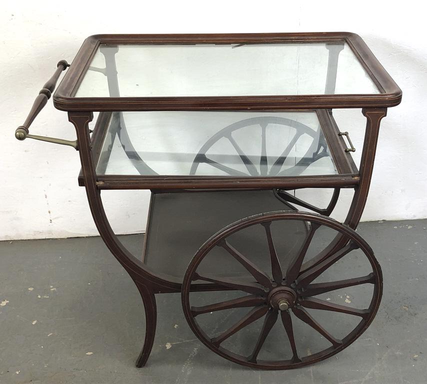 Eduardian Mahogany and String Inlay Bar Cart: Eduardian Mahogany and String Inlay Bar Cart. 31"h x 34 1/2"w x 25"d. Condition, some loss of wood, some loss of rubber to wheels, one wheel missing rubber completely