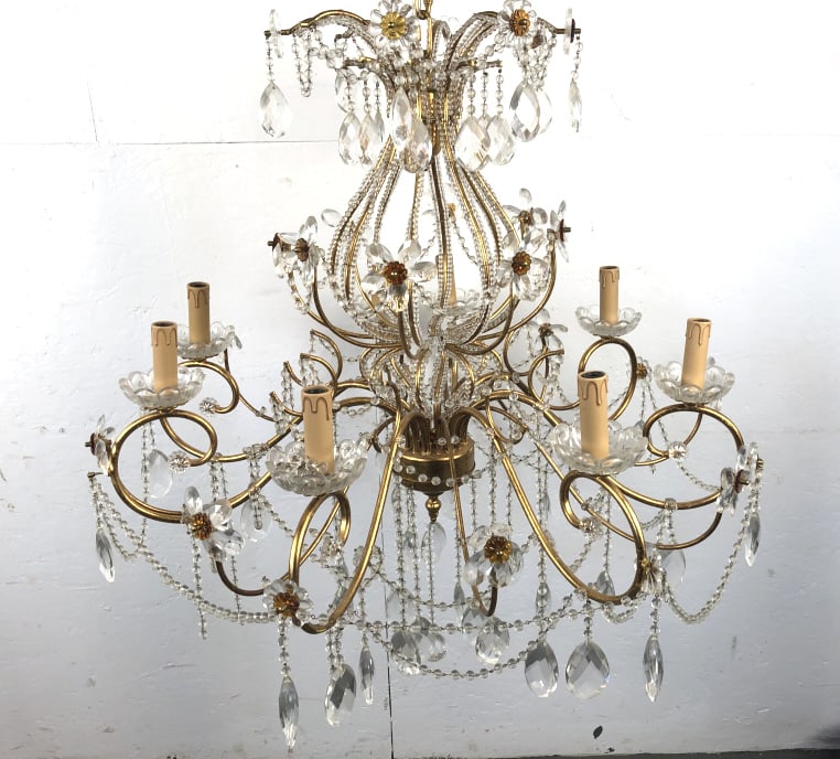 Gilt Metal & Crystal 8 Light Chanderlier: Gilt Metal & Crystal 8 Light Chandelier. With amber accent rosettes. 35"h x 33"diam Condition, untested, some loose crystals, some missing crystals