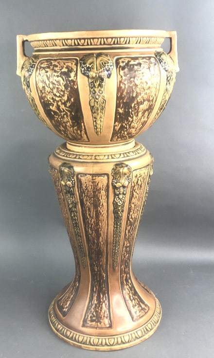 Roseville Pottery Jardiniere: Roseville Pottery Jardiniere. 28 1/2"h x 15 1/2" diam. Condition, chip to base, chip to glaze in handle