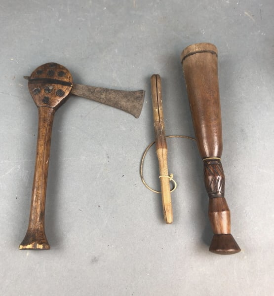 African Dan Wood Tobacco Mortar: African Dan Wood Tobacco Mortar. Together with wood and metal ax. Mortar is 11" long. Condition, overall wear, cracked and chipped wood