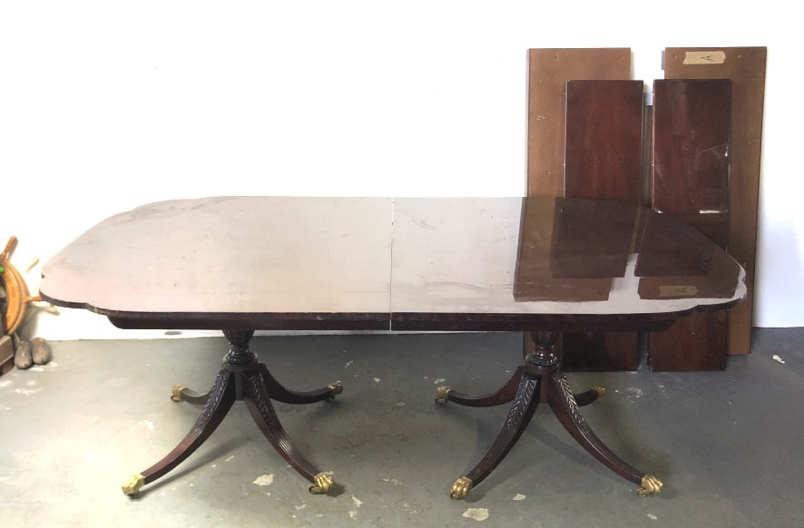 Kindel Twin Pedestal Mahogany Table: Kindel Twin Pedestal Mahogany Table, with four 12" leaves and custom support base. 29"h x 78"w x 46"d. Condition, some scratches and scuffs, some chips to edges