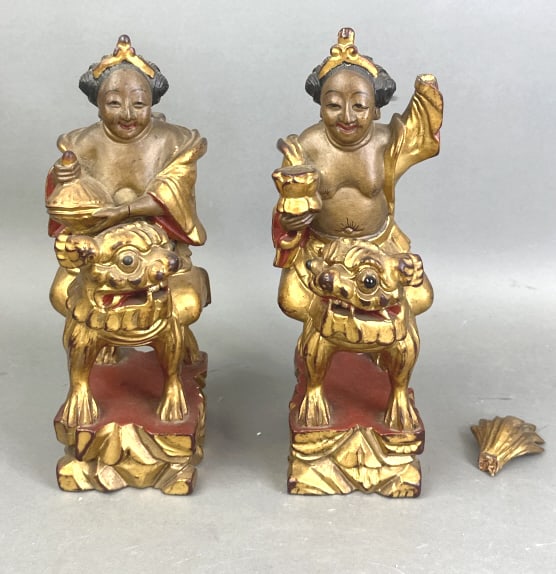 Pair of Asian Gilt Wood Carvings: Pair of Asian Gilt Wood Carvings. 11"h x 4"w x 5 1/2"d. Condition, broken tail needs to be repaired, missing hand , cracks, scratches and scuffs
