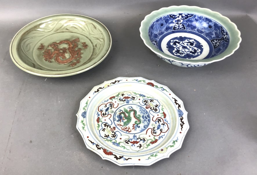 Chinese Wucai Plate: Chinese Wucai Plate, together with celadon bowl and celadon blue decorated bowl. Largest is 3 1/2"h x 12" diam. Condition, some chips to rim of largest