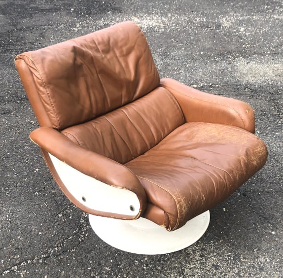 MCM Fiberglass and Leather Armchair: MCM Fiberglass and Leather Armchair. 28"h x 31"w x 34'd. Condition, overall wear to leather, some scratches and scuffs
