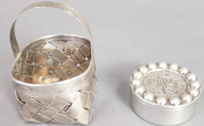Tiffany & Co Paloma Picasso Box & Cartier Basket: Tiffany & Co Paloma Picasso Box & Cartier Basket Tooth Fairy box signed 'Paloma Picasso Tiffany & CO 925 Spain 22344323'. Basket signed 'Cartier Hand Made Sterling'.Total weight: 83.6 Grams Condition: