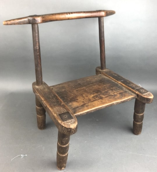 African Baule Carved Wood Chair: African Baule Carved Wood Chair. Ivory Coast 20 1/2"h x 16 1/2"w x 14"d Condition: Overall wear and some cracks to wood rims.