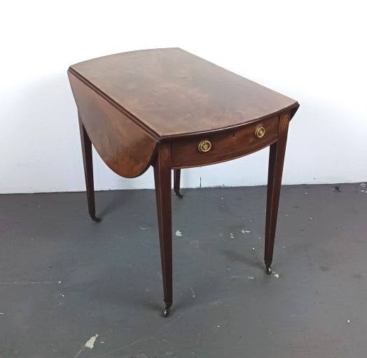 Georgian Inlaid Mahogany Pembroke Table: Georgian Inlaid Mahogany Pembroke Table. With one drawer. Prince of Wales feather plume inlay. 28"h x 20 1/2"w x 33 1/2"d Condition: Some scratches and scrapes, somewear to finish.