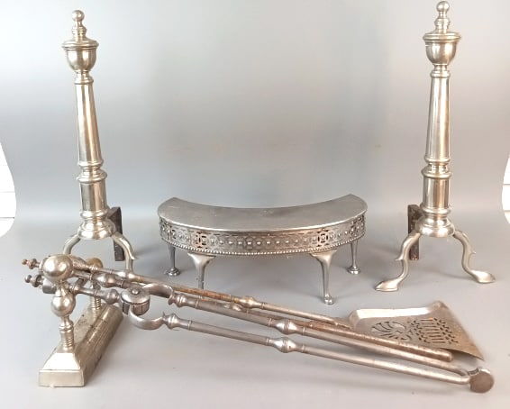 Pair of Pewter Tone Andirons: Pair of Pewter Tone Andirons together with fire tools. Approx. 6 items. Andirons are 23" h x 10"w x 7"d. Condition: Some wear to finish and some surface rust.