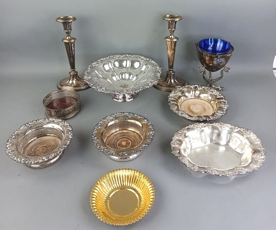 Grouping of Silver Plated Articles: Grouping of Silver Plated Articles 9 pcs. Caviar dish with crab motif and cobalt liner.. Wine coasters and grape decorated bowls. Tallest: 12"h Condition: Overall wear.
