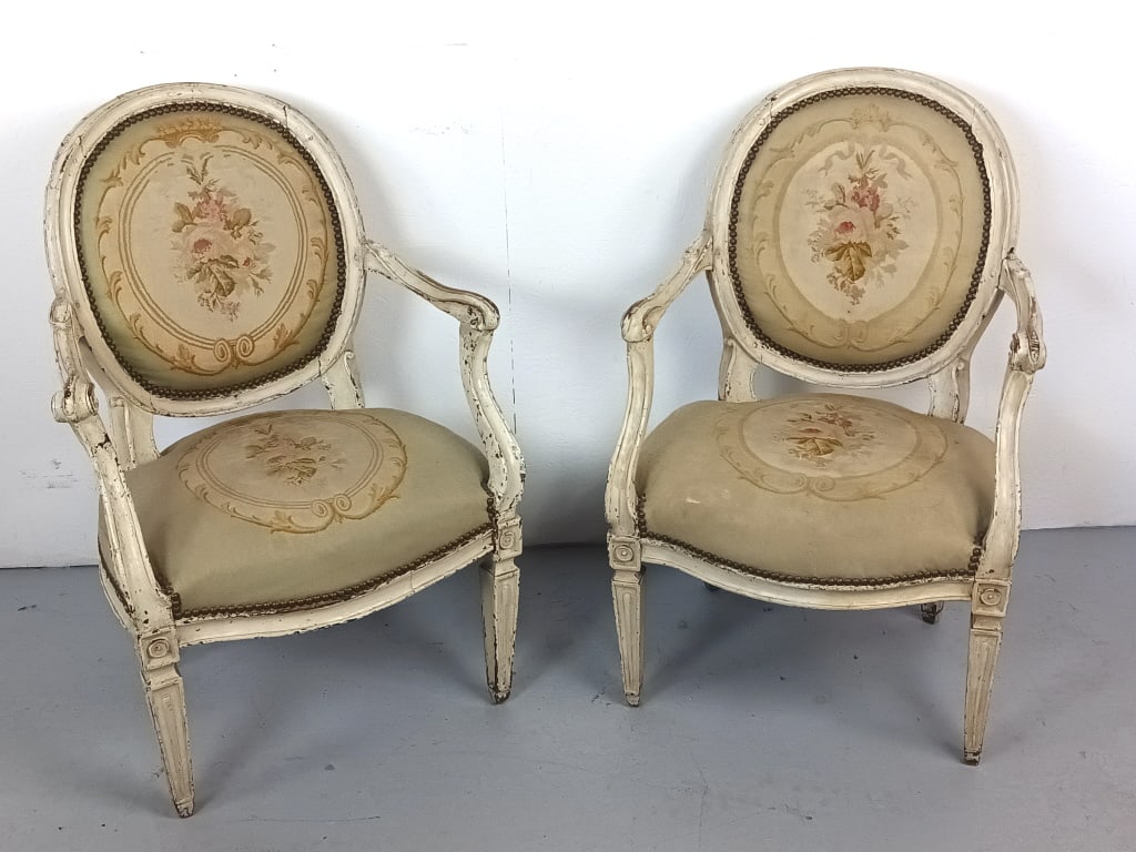 Pair of 19th C. Louis XVl Fauteuils: Pair of 19th C. Louis XVl Fauteuils with tapestry upholstery. 35"h x 23"w x 23"d. Condition: Overall wear to frame, some wear to fabric and old repairs.
