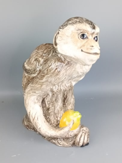Porcelain Monkey: Porcelain Monkey. 21 "h x 18 1/2"w x 9"d Condition: Good.