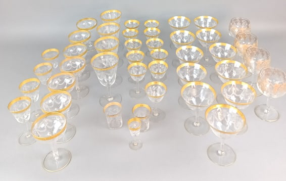 Group of Etched Gold Rim Glasses: Group of Etched Gold Rim Glasses. Approx. 42 pieces. Tallest: 6 1/2"h. Condition: Some rubbed gilt, chip to one base and 6 glasses with minor chips to rim.