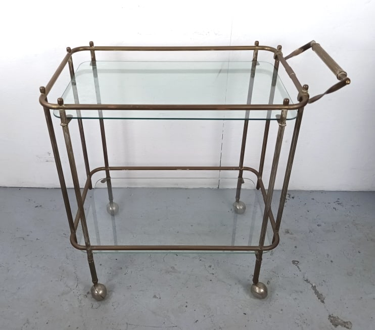 Brass and Glass Drink Cart: Brass and Glass Drink Cart. 33"h x 33 1/2"w x 17 1/2"d Condition: Needs polishing and some pitting to wheels.