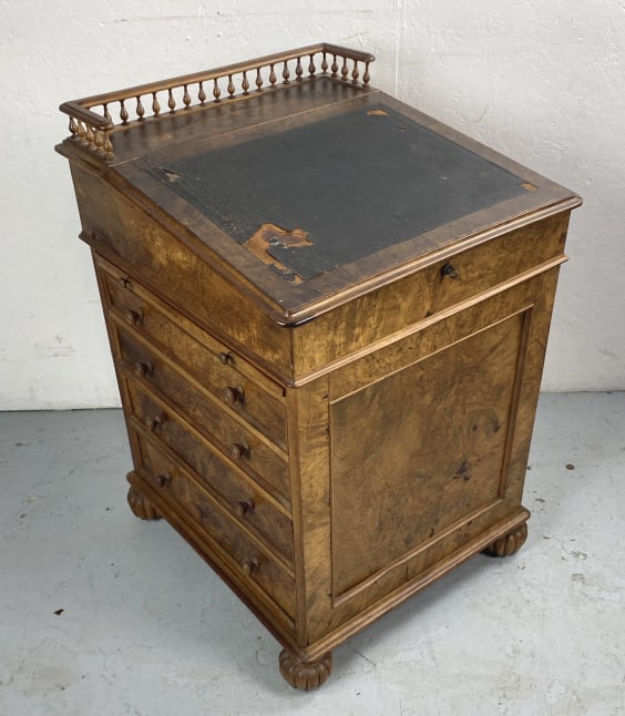 Regency Walnut Davenport Desk: Regency Walnut Davenport Desk. Mfg by James Winter & Son Soho London. 36"h x 24"w x 25"d Condition: Some leather loss, sun fading, cracked and chipped veneer.
