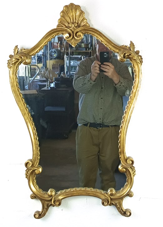 Florentine Style Giltwood Mirror: Florentine Style Giltwood Mirror. 27"h x 22 1/2"w. Condition: Some open seams.