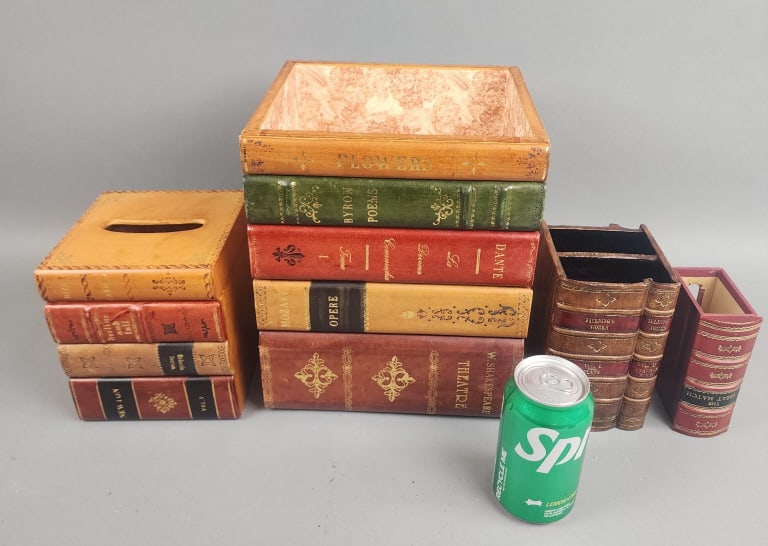 Group of 4 Faux Book Containers: Group of 4 Faux Book Containers. Consisting of a tissue holder, waste basket, remote control holder and one for matches. 10 3/4"h x 9"w x 8"d Condition: Light wear