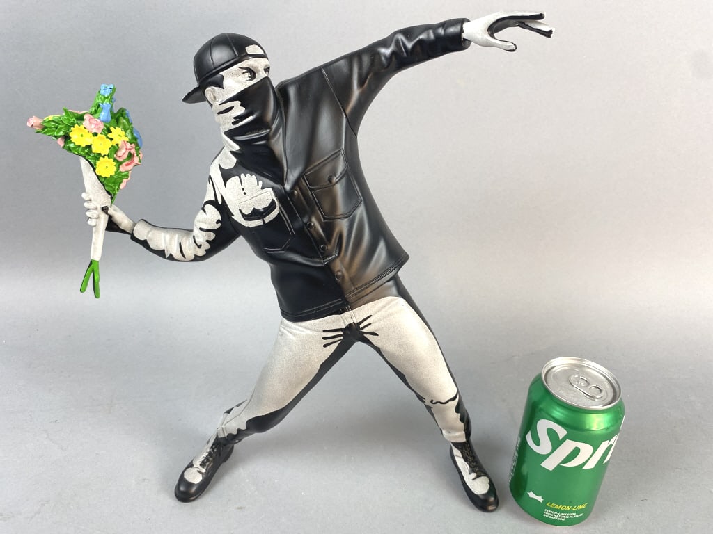 After Banksy The Flower Thrower Sculpture: After Banksy The Flower Thrower Sculpture. 16"h Condition: Good.
