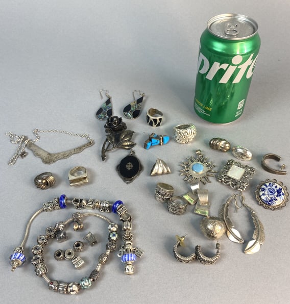 Grouping of Sterling Silver Jewelry w/ Pandora: Grouping of Sterling Silver Jewelry with Pandora bracelets. Condition: 3 single earrings.