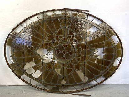 Oval Stained Glass Window: Oval Stained Glass Window. Provenance: Cafe Figaro on Bleeker & MacDougal St. N.Y.C. 51"h x 69"w Condition: As is, loss of glass, crackedglass and bent metal.