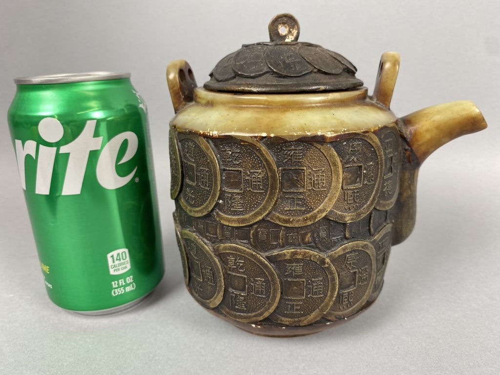 Antique Chinese Bronze Coin & Jade Teapot: Antique Chinese Bronze Coin & Jade Teapot. 6 1/4"h x 7"w Condition: May be missing handle, some wear to bottom and oxidation to top.