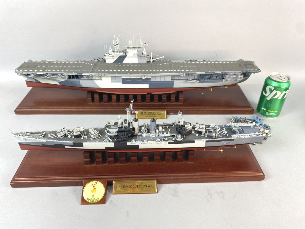 USS Enterprise & USS Honolulu Ship Models: USS Enterprise CV-6) & USS Honolulu (CL-48) Ship Models. Made of metal and wood. 8"h x 28"w x 6"d Condition: Some small scuffs to woodplatform.
