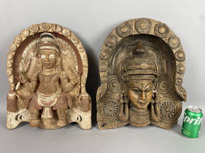 Two 18th C. Indian Carved Wood Statues: Two 18th C. Indian Carved Wood Statues. Larger of face: 20"h x 15"w x 3"d Condition: Cracked wood, and missing wood .