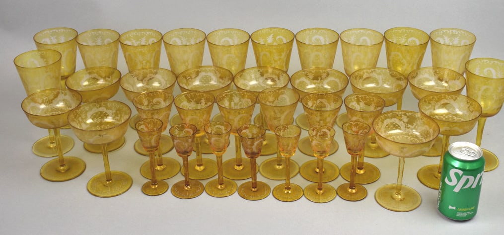 Bohemian Amber Cut to Clear Crystal Glasses: Bohemian Amber Cut to Clear Crystal Glasses. 12 water glasses, 2 chipped. 11 champagne glasses, 1 chipped. 6 wine glasses. 7 port glasses.Tallest: 7 3/4"h Condition: See above.