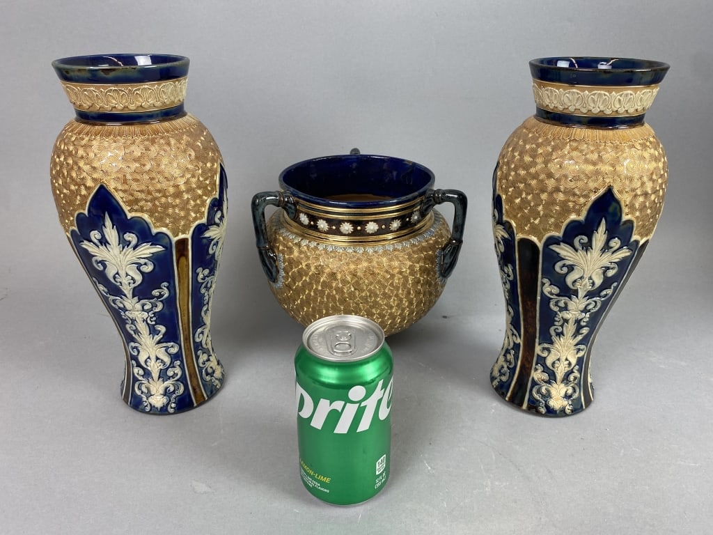 Pair of Royal Doulton Art Nouveau Gilt Vases: Pair of Royal Doulton Art Nouveau 'Gilt Circle Ware' Vases. Along with a Royal Doulton Lambert tri-handle jardiniere. Vase: 11 1/4"hCondition: Good.