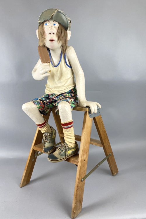 Folk Art Boy Sitting on Ladder: Folk Art Boy Sitting on Ladder eating ice cream. 30"h x 16"w x 20"d Condition: Some cracks to hat visor.
