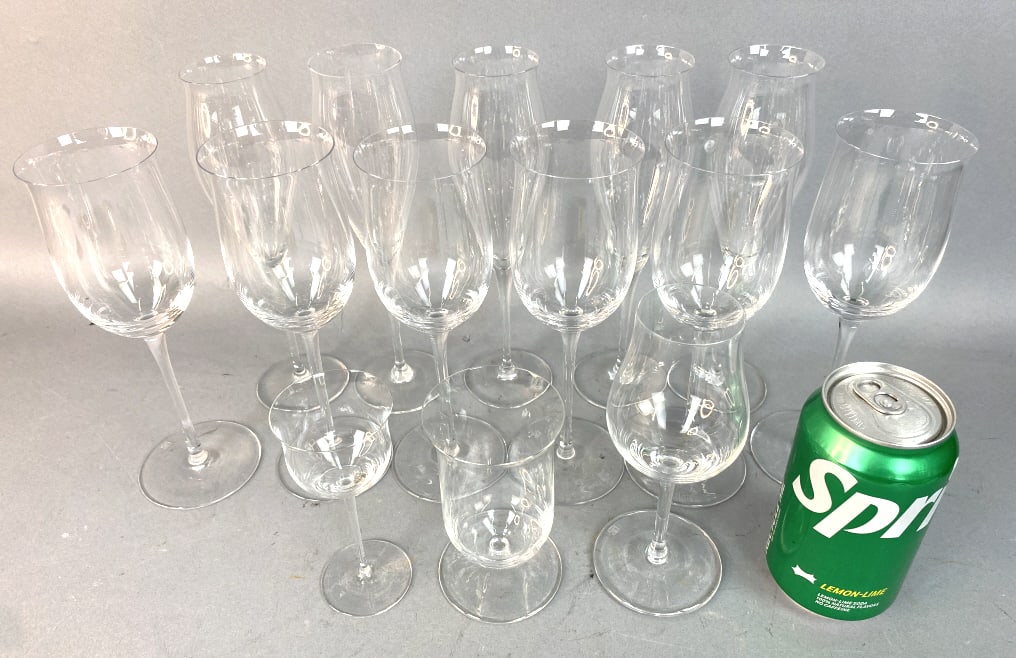 Riedel Grand Cru Crystal Stemware: Riedel Grand Cru Crystal Stemware 14 pcs. 5 champagne 5 wines 1 sherry 1 small wine Tallest: 8 1/4"h Condition: Good.