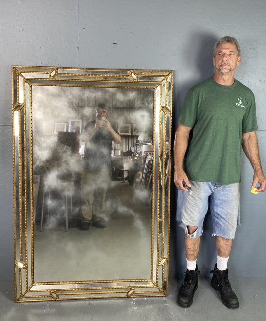 Italian Giltwood Mirror: Italian Giltwood Mirror. 55"h x 43 1/4"w Condition: 2 cracked panels on frame.