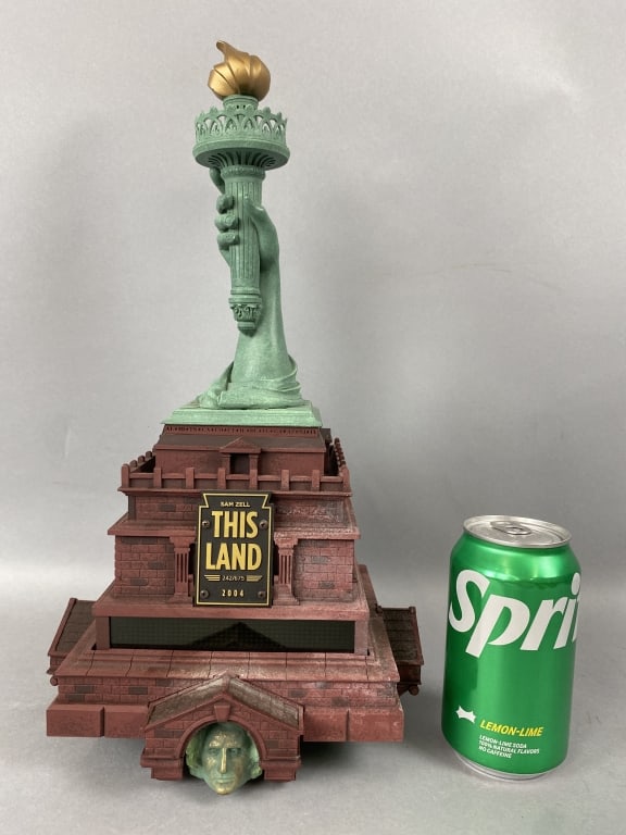 Sam Zell "This Land 2004" Automaton Music Box: Sam Zell "This Land 2004" Automaton Music Box. 15"h x 8 1/2"w x 8 1/2"d Condition: Untested, missing power supply.