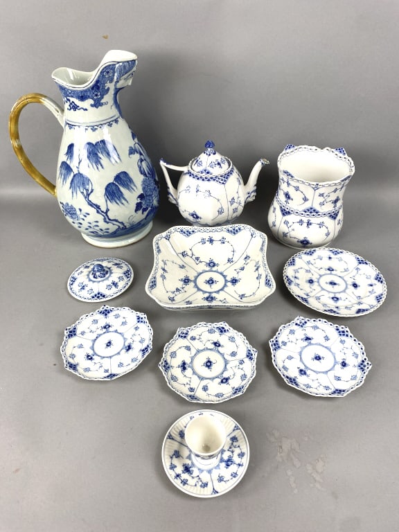 Royal Copenhagen Blue Fluted Items w/ Chinese: Royal Copenhagen Blue Fluted Items w/ Chinese Vase. Pitcher: 13 1/2"h Condition: Chips on blue fluted wine cooler, larger plate, 2 small plates, & egg cup. The teapot has a old repair & chip to spout.