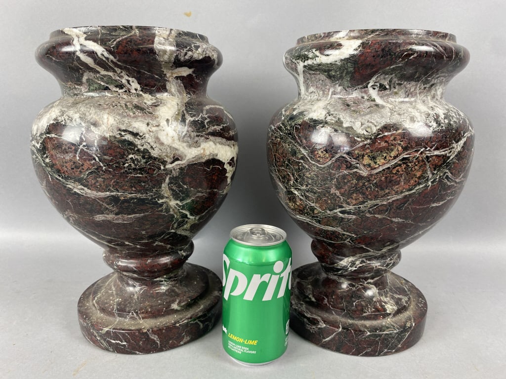 Pair of Neoclassical Style Red Zebra Stone Urns: Neoclassical Style Red Zebra Stone Urns. 12"h x 8"diam. Condition: Needs cleaning, scratches.