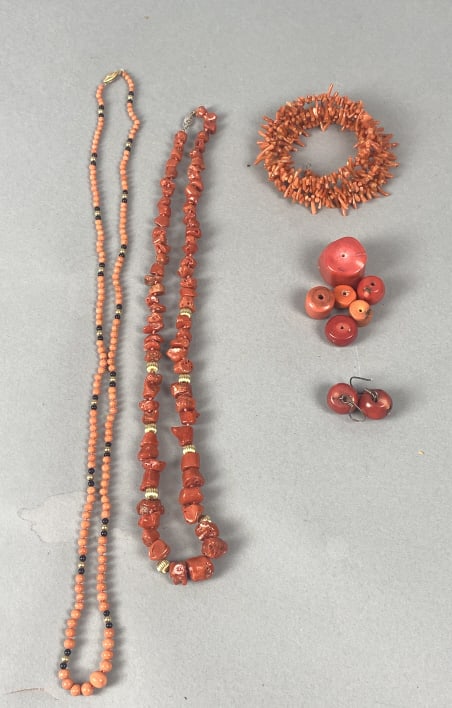 Group of Coral Jewelry Articles: Group of Coral Jewelry Articles. Comprising of: 2 necklaces w/ 14kt gold clasp & beads 1 pair earrings 1 bracelet 6 beads Condition: Good.