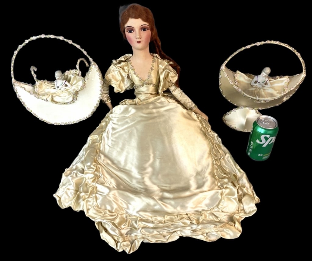 1935 Doll w/ Satin Accessories: 1935 Doll with Satin Accessories. Comprising of: Doll 2 porcelain doll baskets Pair of 4 poster bed covers Twin bed topper Pillow cover 2 table runners 4 napkins Doll: 30"h Condition: Some loss of hai