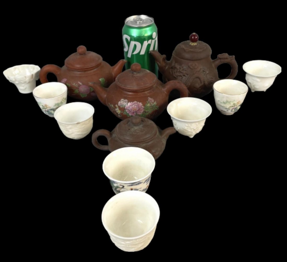 Chinese Miniature Teapots & Cups: Chinese Miniature Teapots & Cups. Largest teapot: 4 1/2"h Condition: 1 chipped cup.