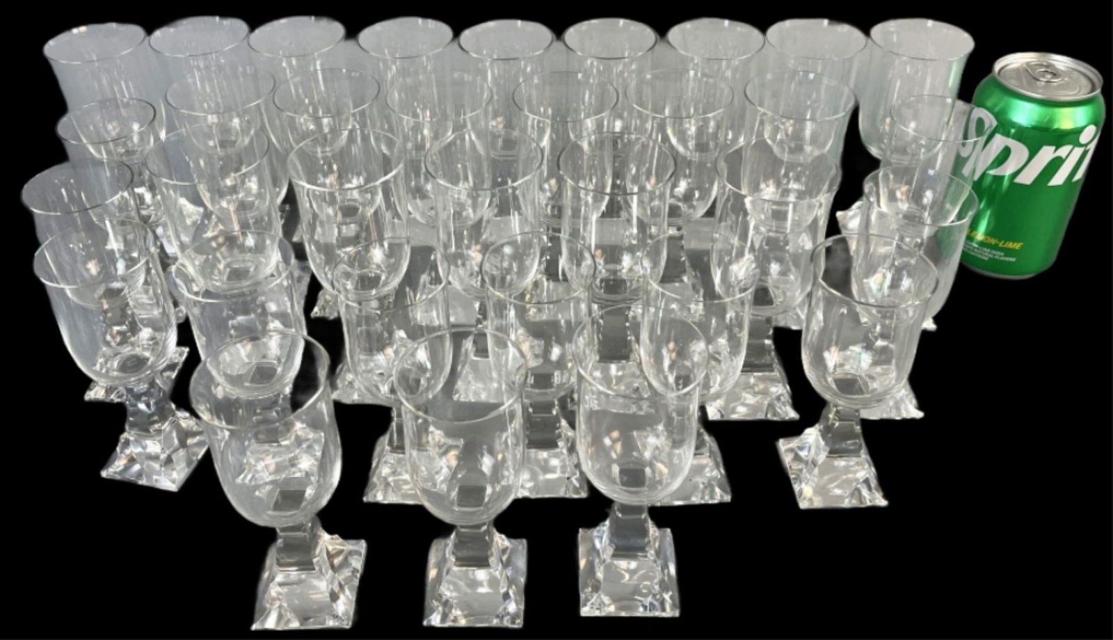 Baccarat Maladetta Crystal Glasses: Baccarat Maladetta Crystal Glasses. Comprising of: 20-5 1/2"h, 3 base chips 13-4 3/4"h, 4 base chips Condition: See above.